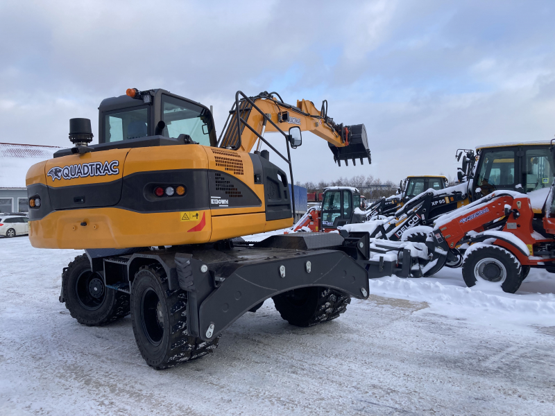 Мини-экскаватор QUADTRAC E130WH (12т, кабина, квикаплер)